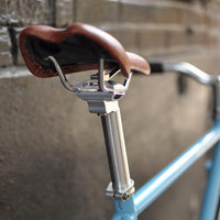 This fixed gear bicycle is called "The Prince" and features white rims and a sky blue frame.