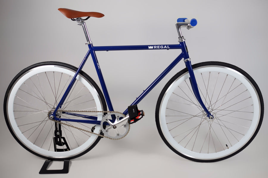 Fixie Bike and Single Speed Bike with Blue Rims and a White Frame