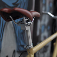 This fixed gear bicycle is called "The Count" and features white rims and a cream frame.