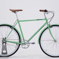 City Bike by Regal Bicycles with a Mint Green Frame and White Wall Rims, featuring a Shimano Nexus 3 Speed Internal Gear Hub built for commuting